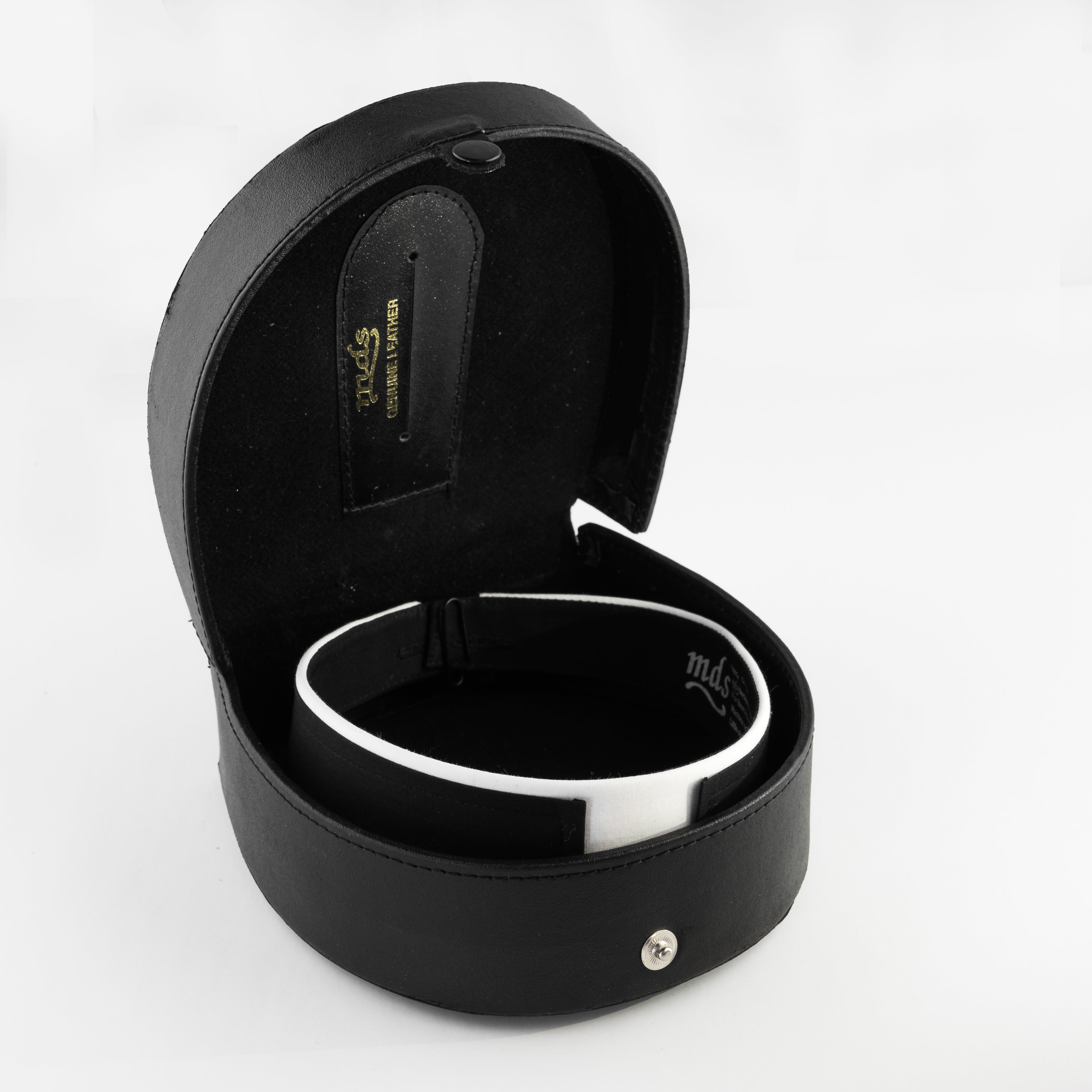 small black D shaped leather case with a snap button on the front, perfectly fitting clergy collar inside. Fully open to see collar resting snugly inside case. 