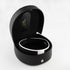 small black D shaped leather case with a snap button on the front, perfectly fitting clergy collar inside. Fully open to see collar resting snugly inside case. 